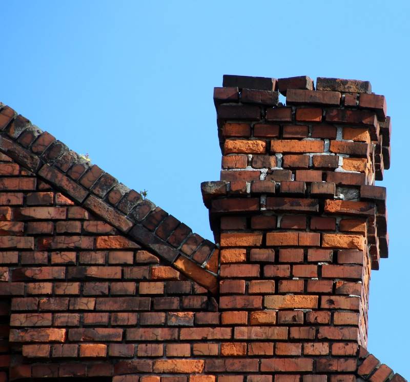 Damaged chimney on an Rancho Santa Fe home showing cracks and missing mortar
